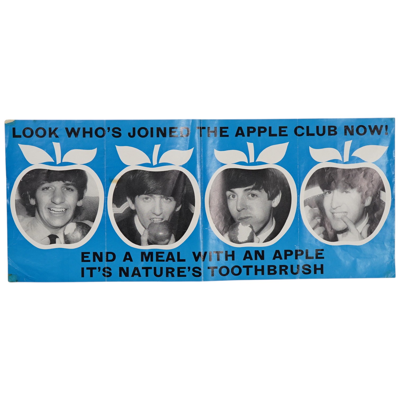 An original 1967 poster promoting the Beatles eating apples as part of the British Council of Dentistry's campaign, reads; ‘Look who's joined the apple club now', on a blue ground, 43 x 18cm